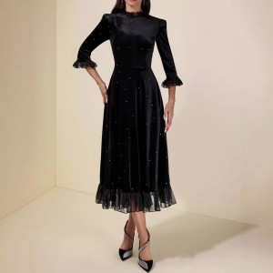 Black sequined chiffon halter-neck dress with three-quarter sleeves and frilled edges